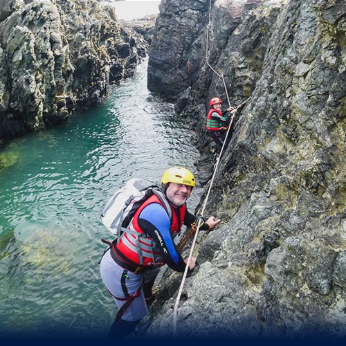 Couple Sea Level Traversing a Rockpool